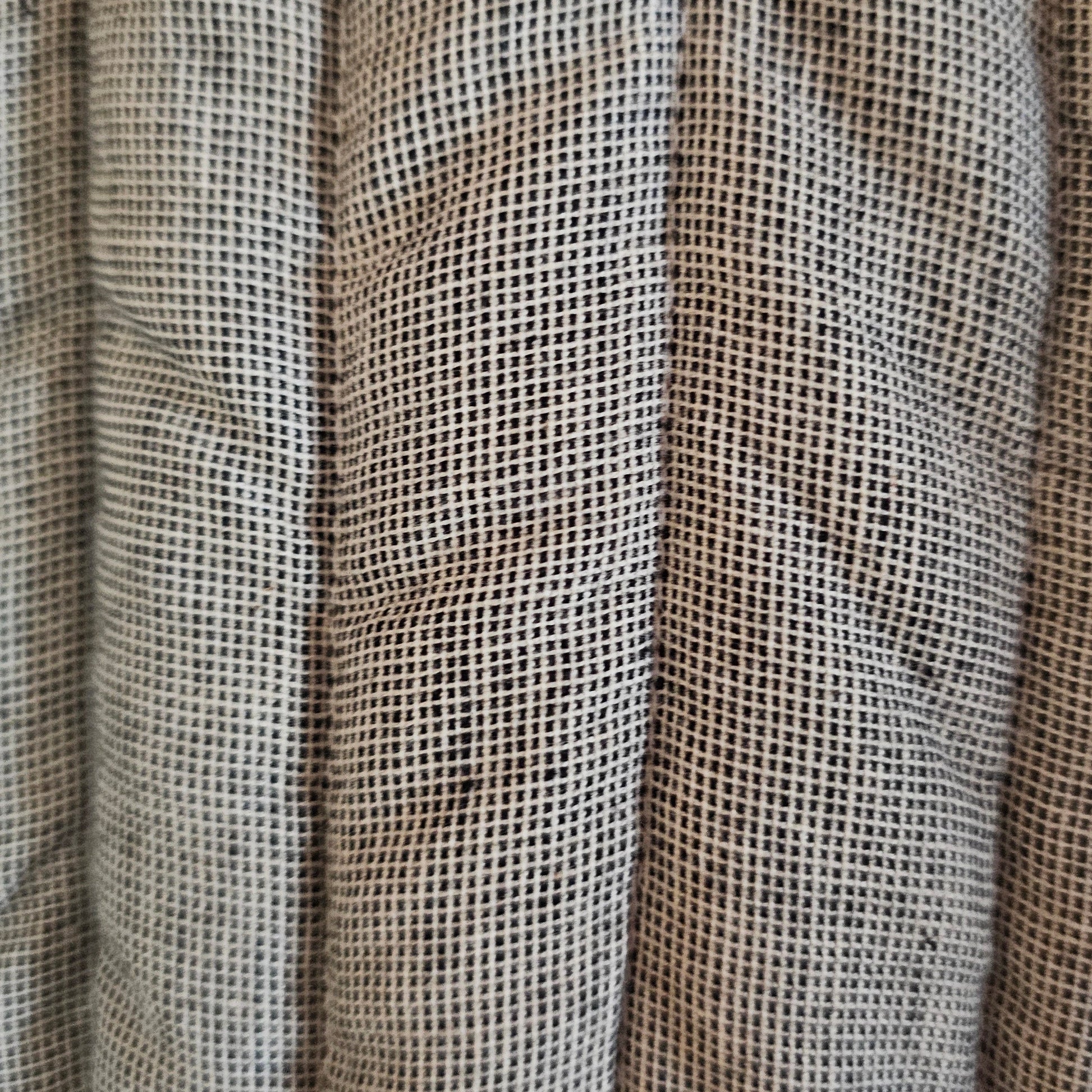 Close-up of woven fabric with a grid pattern