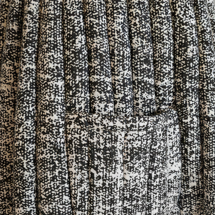 Close-up of a textured fabric with black and white pattern